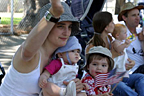 Mom, Nat and Me waving to the people in the parade